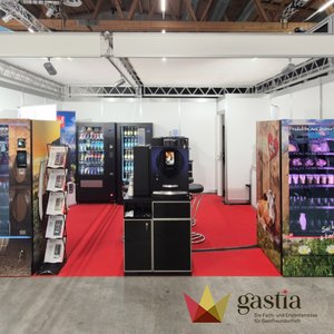 Sielaff Schweiz GmbH trade show booth with coffee machines and snack vending machines on red carpet at Gastia 2026 trade fair